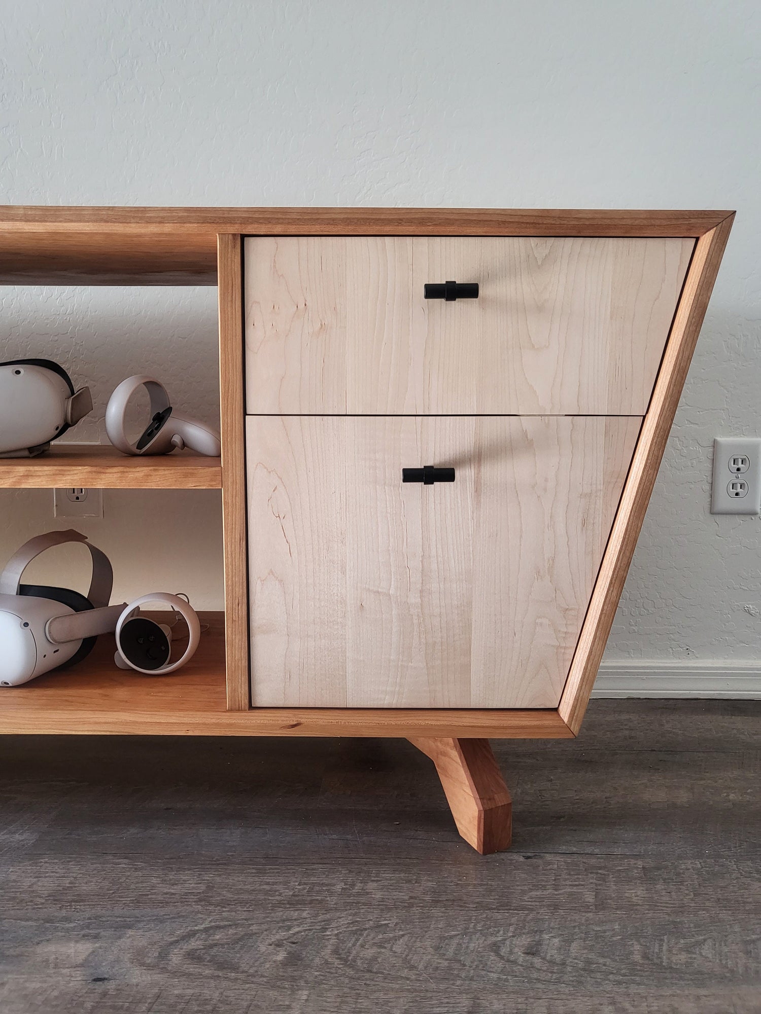 15 degree trapezoid shape makes for drawer faces that are stunning and unique. Crafted out of solid Curly Maple the contrast with the Cherry makes them pop